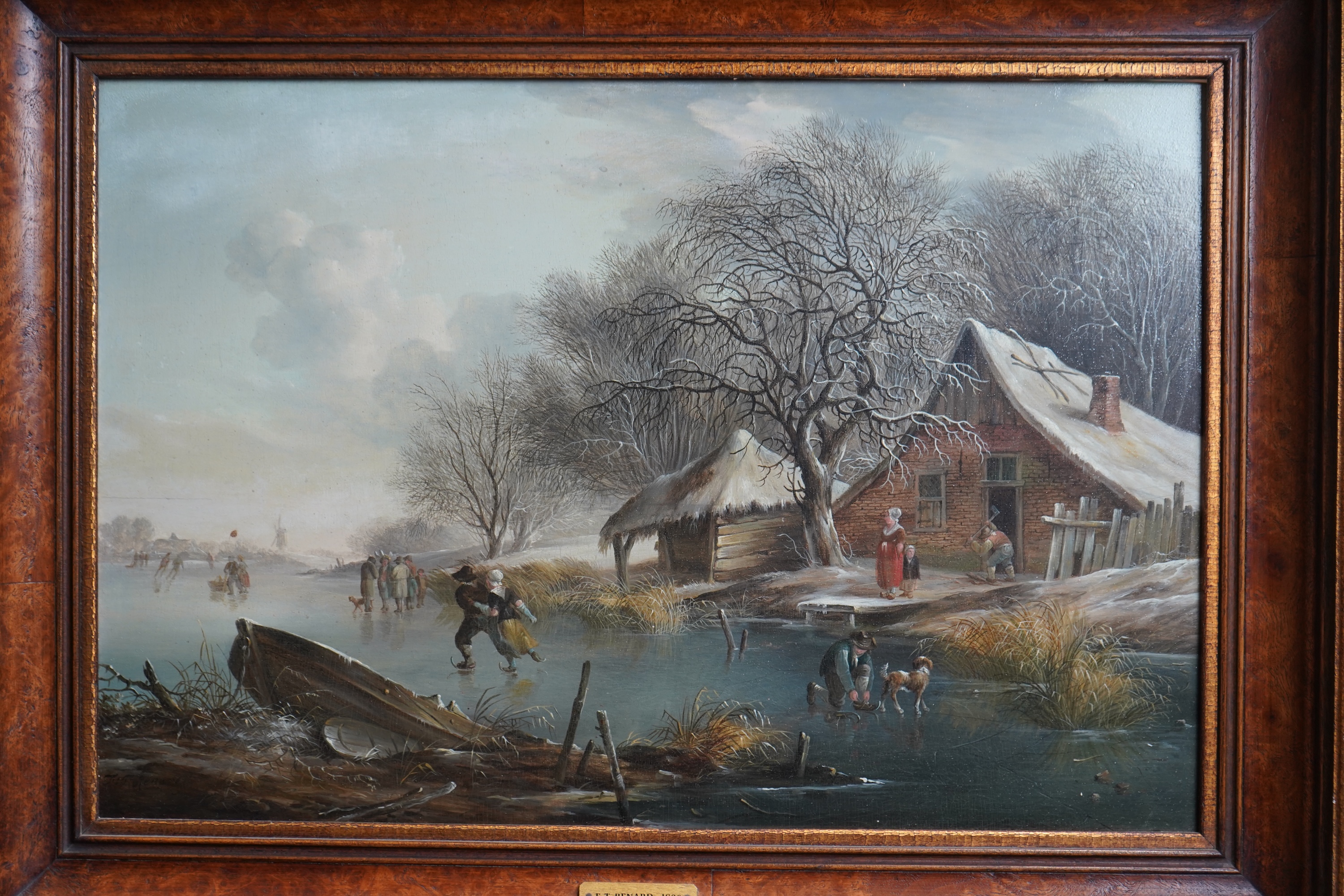 Fredericus Theodorus Renard, Dutch 1778-1820, A Winter landscape with figures skating on a frozen canal